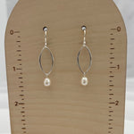 Handmade pearl drop earrings with double marquis frames displayed on wooden earring card showing 1.5 inch length