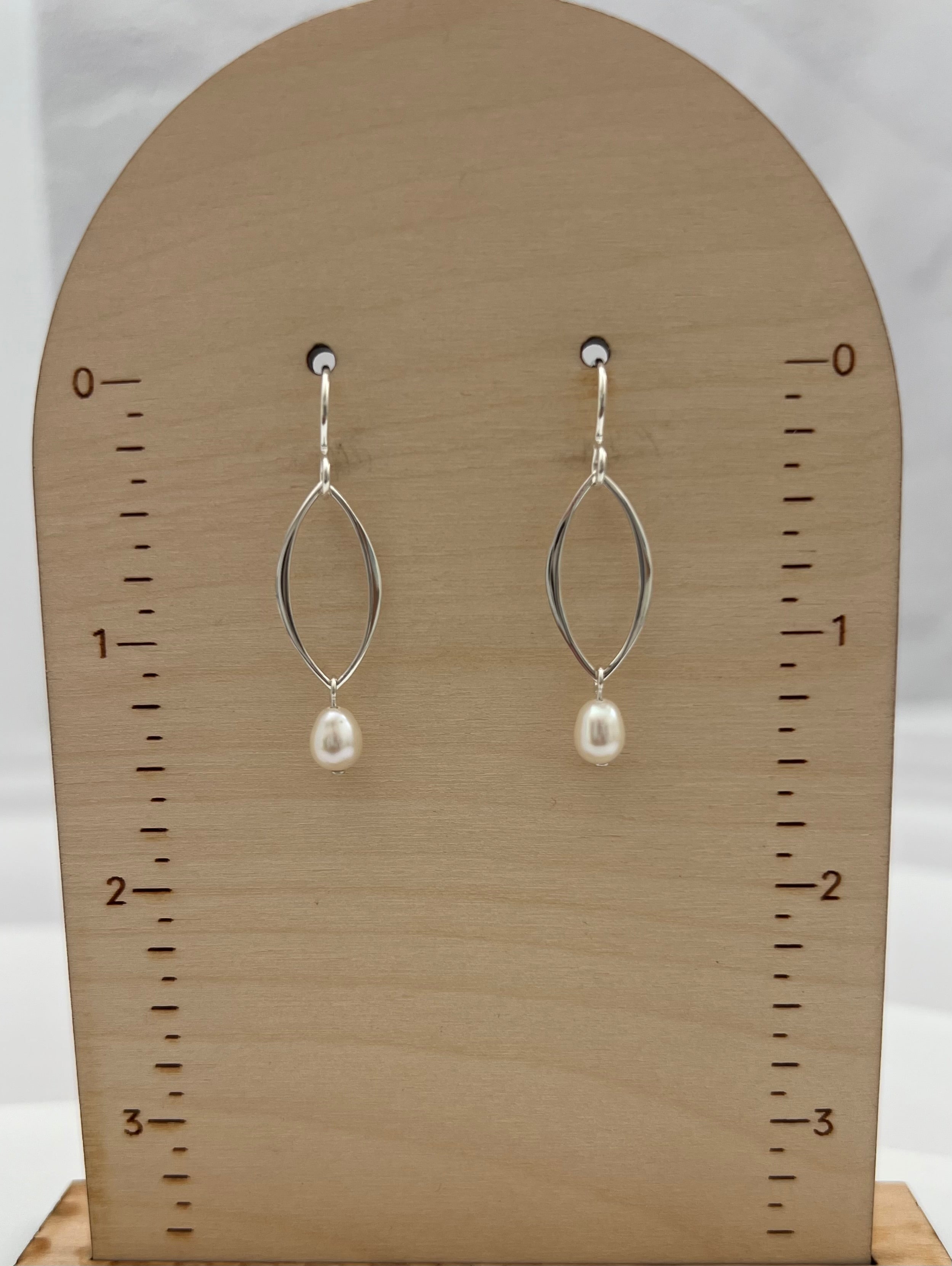Handmade pearl drop earrings with double marquis frames displayed on wooden earring card showing 1.5 inch length