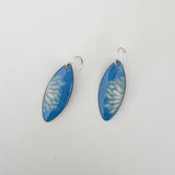 French blue enamel marquise earrings with cream flower petal pattern on sterling silver ear wires on white background 