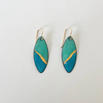 Handcrafted seafoam and ocean blue enamel earrings with textured gold foil inlay by Dawn Carlson Designs. 14 gold fill ear wires.